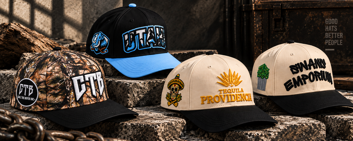 A lineup of four custom Untitled Goods hats: Call The Buyer Inc camo trucker, Utah hockey team hat, Tequila Providencia hat, and Swann Emporium hat